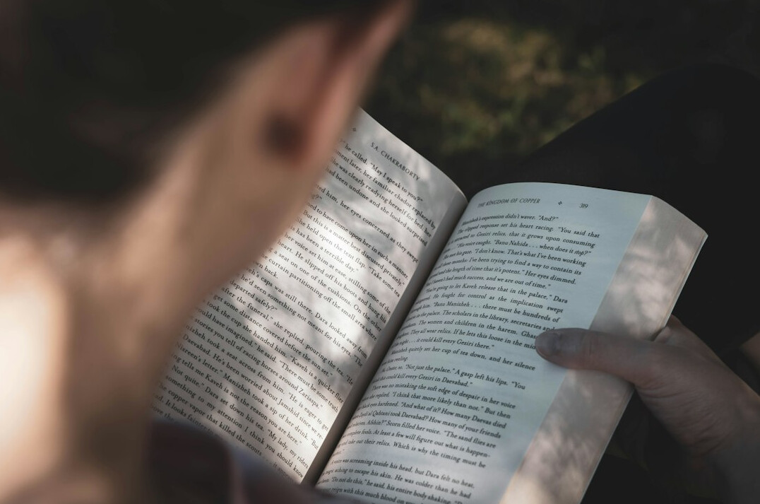 person reading old book