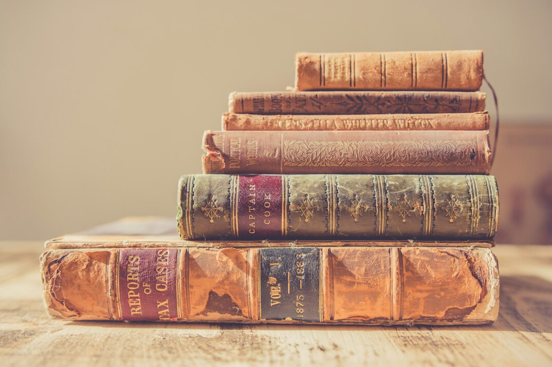 rare old books stacked