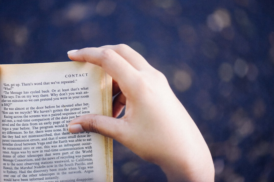person reading old book